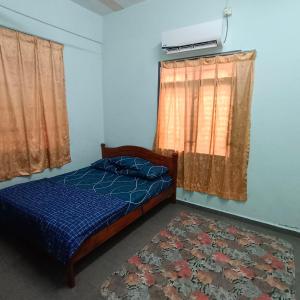 Maju Homestay Kuala Terengganu客房内的一张或多张床位