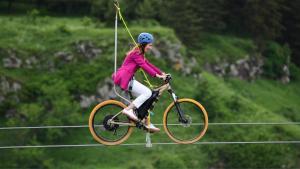 TsalkaKass Diamond Resort的骑着自行车的女子