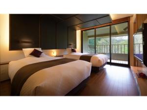 Oshuku Onsen Choeikan - Vacation STAY 55593v客房内的一张或多张床位