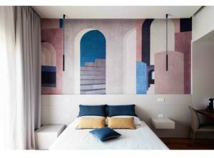 巴里Nonno Nicola Rooms的一间卧室配有一张壁画床