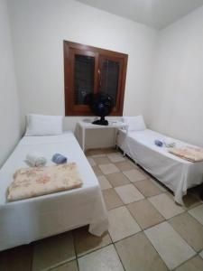 Recanto Pau Brasil客房内的一张或多张床位