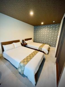 成田NARITA HOTEL KAKUREGA - Vacation STAY 69221v的两张床位 - 带两张西德西德床