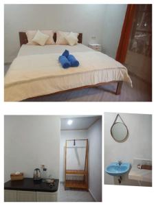 OhoililirRenata Cottages的一间卧室配有一张带蓝色枕头的床