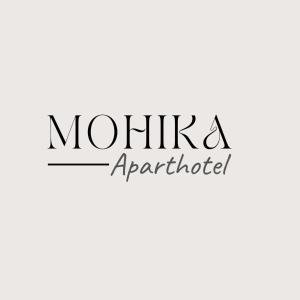 第比利斯Mohika Aparthotel的读穆西卡帕帕帕建筑师的标志