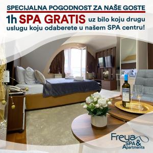尼什Freya SPA Apartments的一间设有一张床和一张桌子及一瓶葡萄酒的客房