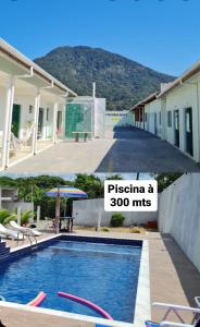 佩鲁伊比Porto Suítes Peruíbe的一座别墅,设有游泳池,标有1英里(1.6公里)比萨饼