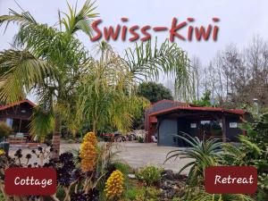 陶朗加Swiss-Kiwi Retreat A Self-contained Appartment or a Tiny House option的读瑞士 ⁇ 猴桃和餐馆的标语