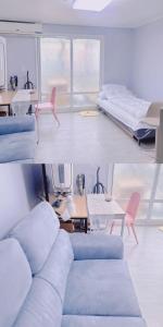 首尔A-one的客厅配有沙发和桌子