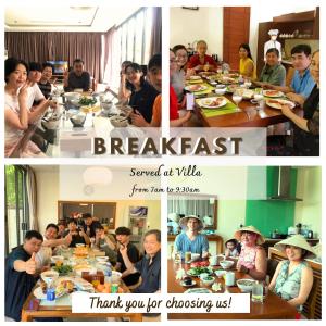岘港Da Nang Paradise Center My Khe Beach Resort & Spa的一群坐在桌子旁吃食物的人