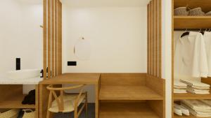 帕拉马Pontikonisi Hotel & Suites的一间带木制书桌和盥洗盆的浴室