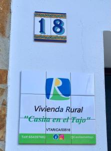 塞特尼尔Casita en el Tajo的八号楼边的标志