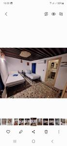非斯Riad Fes EL KAID的一张房间的照片,里面放着两张床