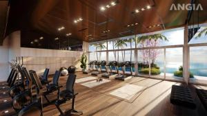 头顿The Song Vũng Tàu - Luxury House的健身房设有一排椅子和大窗户