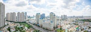 胡志明市LANDMARK PLUS RESIDENCES LUXURY SUITE的城市空中景观高楼