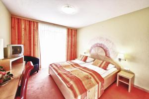 加斯特霍夫古特曼酒店客房内的一张或多张床位