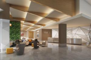 欧文The Westin Irving Convention Center at Las Colinas的一个带沙发和椅子的酒店大堂