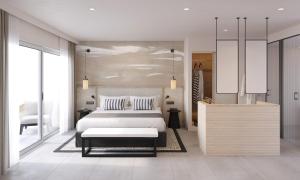 伊斯费古耶拉尔海滩因维萨卡拉布兰卡俱乐部酒店的一间卧室配有一张床和一张桌子