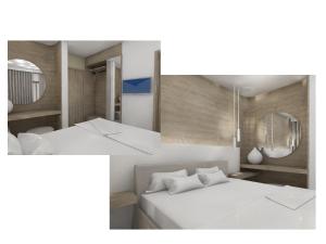 科斯镇考拉酒店的一间设有白色床和镜子的客房