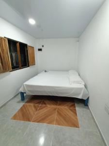Urantia Beach Hostel & Camping客房内的一张或多张床位