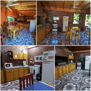 伊瓜苏港Hostel el Amanecer的厨房配有木制橱柜、桌子和冰箱。