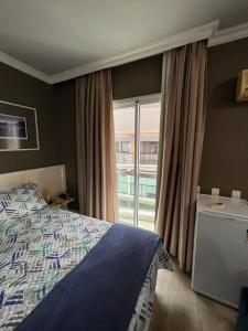 HOTEL PERDIZES - FLAT Executivo - 1204客房内的一张或多张床位