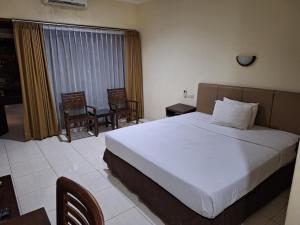 Makati Pasuruan Hotel客房内的一张或多张床位