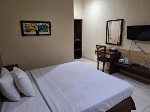 Makati Pasuruan Hotel客房内的一张或多张床位