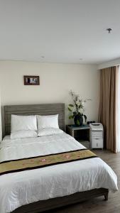 Apec Mandala Phú Yên View Biển客房内的一张或多张床位