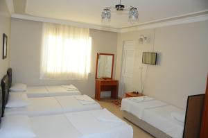 多特季节酒店客房内的一张或多张床位
