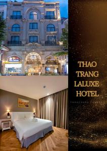 胡志明市Thao Trang Laluxe Hotel Phu My Hung的酒店客房带床,大楼
