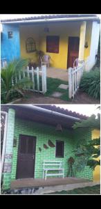 MeruocaMirante toca da raposa的绿色和黄色的房子,有白色的围栏