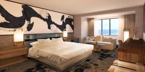 大西洋城凯撒大西洋城赌场度假酒店的一间卧室设有一张床和一间客厅。