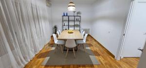 卡拉瓦卡·德·拉·克鲁斯Apartamento Gómez的一间带木桌和白色椅子的用餐室