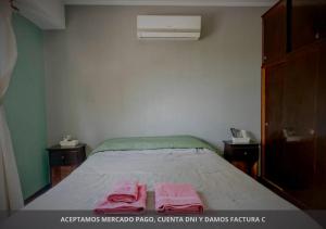 Habitación Tres Arroyos客房内的一张或多张床位