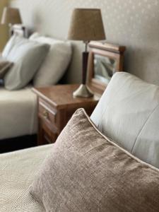Las Bayas Home Suites客房内的一张或多张床位
