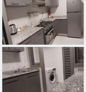 马斯喀特Oceana Flat的厨房配有水槽和洗衣机