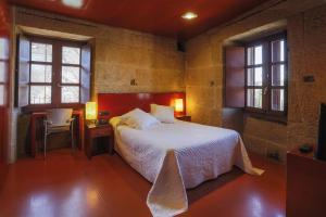 Casa Rural Torre Lombarda客房内的一张或多张床位