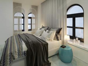 波兹南城市公园公寓酒店的白色的卧室设有床和窗户