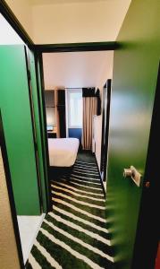 Hotel Joinville Hippodrome客房内的一张或多张床位