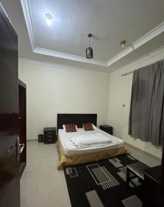 达赫拉Appartements de luxe à Al Mahdi的卧室配有一张床