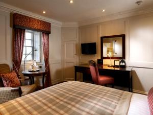 麦克唐纳德豪斯顿别墅酒店客房内的一张或多张床位