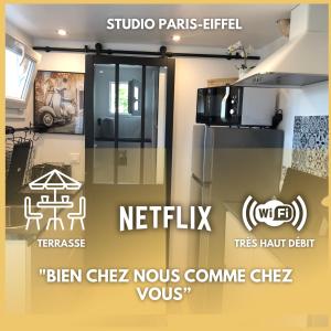 庞坦Paris-Eiffel, bienvenue -terrasse -Netflix的厨房的标志,厨房配有不锈钢冰箱