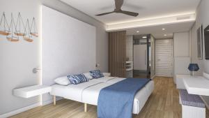 Cala MendiaBlau Punta Reina的一间卧室配有一张床和吊扇
