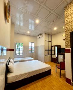Khách sạn Nam Đô 2客房内的一张或多张床位