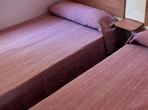 Bungalows Zaragoza Camping客房内的一张或多张床位
