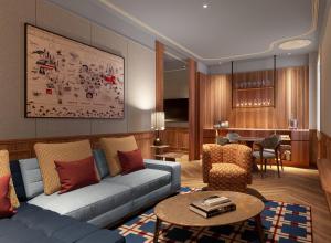 巴塞罗那Grand Hotel Central, Small Luxury Hotels的客厅配有沙发和桌子