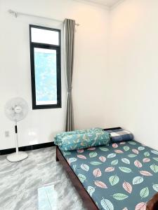 Koi Guest House - Phan Thiết客房内的一张或多张床位