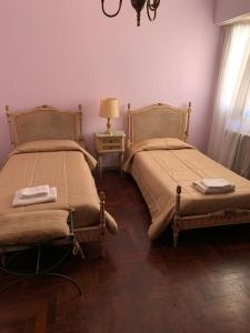 CASA RAWSON TEMPORADA客房内的一张或多张床位