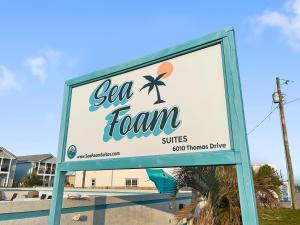 巴拿马城海滩Sea Foam Suites的海绵网球诊所标志
