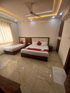 Hotel Ganga Palace By Goyal Hoteliers客房内的一张或多张床位